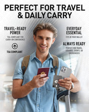 Man holding passport and phone with AquaVault charge card, ready for travel.