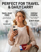 Woman holding a phone with AquaVault ChargeCard and passport for travel.