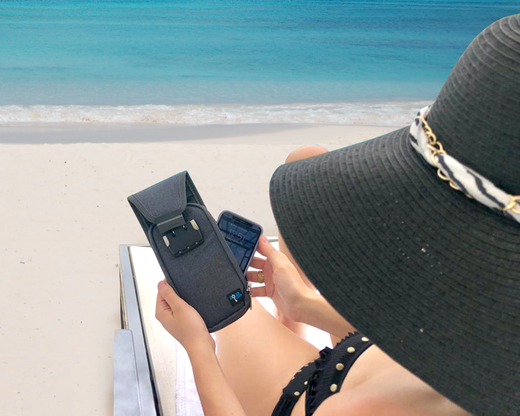 a lady using AquaVault flexsafe on beach
